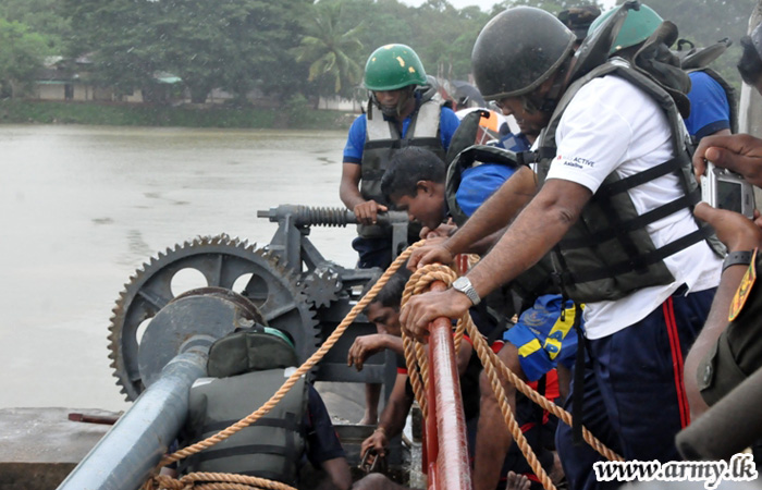 Troops Open Jammed Sluice Gate Averting Catastrophe