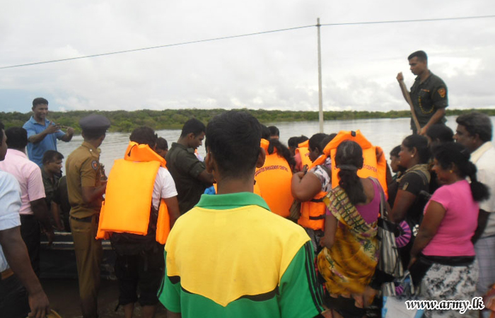 Troops Ferry Stranded Civilians Across Mandagal Aru Bridge