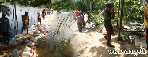 SFHQ-West Troops Brave Crocodile Threats & Build Sand Bund