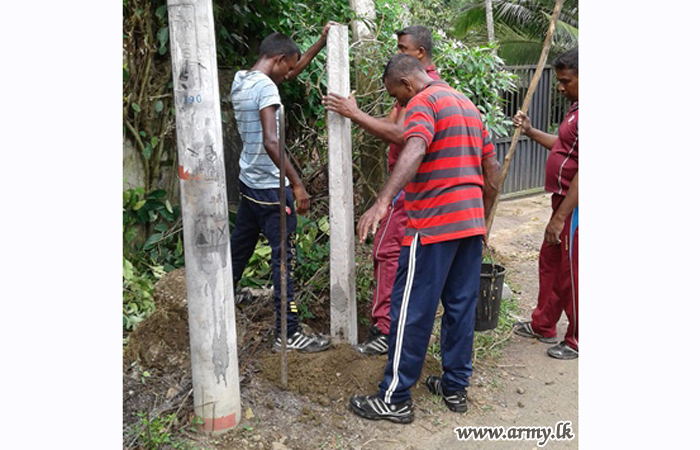 58 Division Troops Put up School Fence 