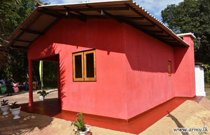 Buddhist Monks with Troops Erect New House for Needy Family in Manikapuram & Provides School Needs