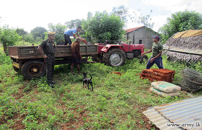 Poor Man Supplied with Raw Materials for House Construction