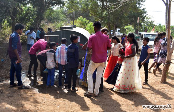 Troops Give Drinking Water to Church Feast