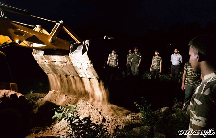 Troops on Standby Stack Sand Bags Atop Nilwala River Bank