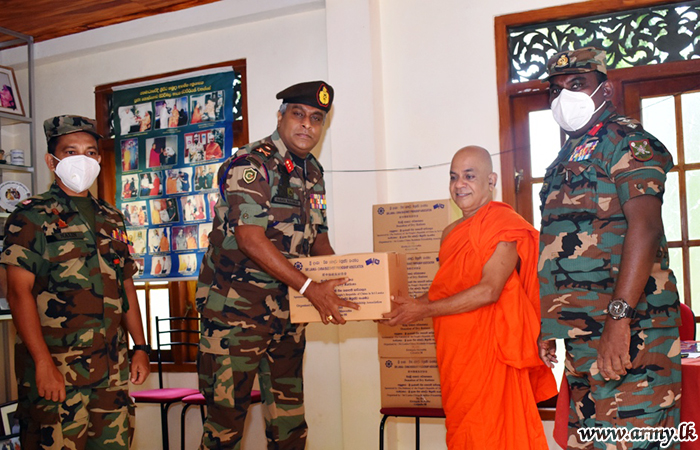 61 Division Troops Distribute Relief Items among Monks in Temples
