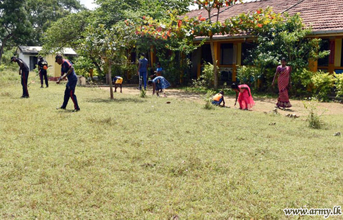 Troops with Civilians Clean up Primary School Premises