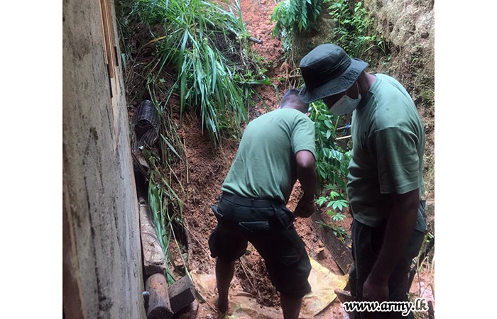 112 Brigade Soldiers Mitigate Landslide Risks around Late Soldier's House 