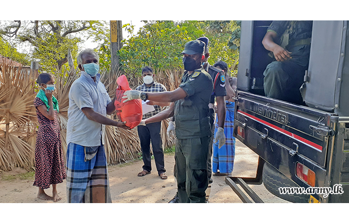 242 Brigade Troops Distribute Relief Packs to Ten Families