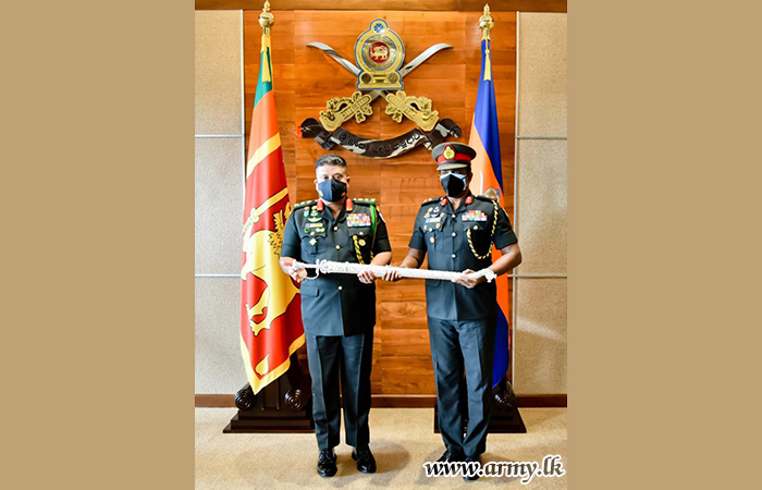 Promoted Senior Officer Receives Insignias from His Chief 