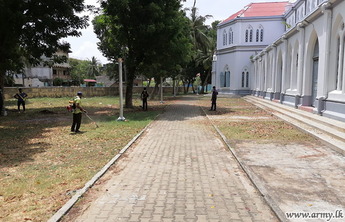 Troops Clean Church Compound 