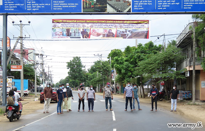 24 Division Troops Hang Banners to Educate the Public on COVID-19