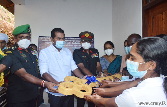 2 SLSR Troops with State Funds Erect New House for a Needy Family