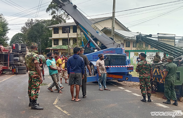 Central Troops Help Remove Toppled Bowser