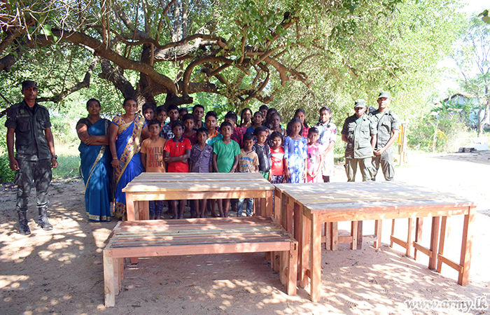 Troops’ Helping Hand Gets Desks & Benches to Students