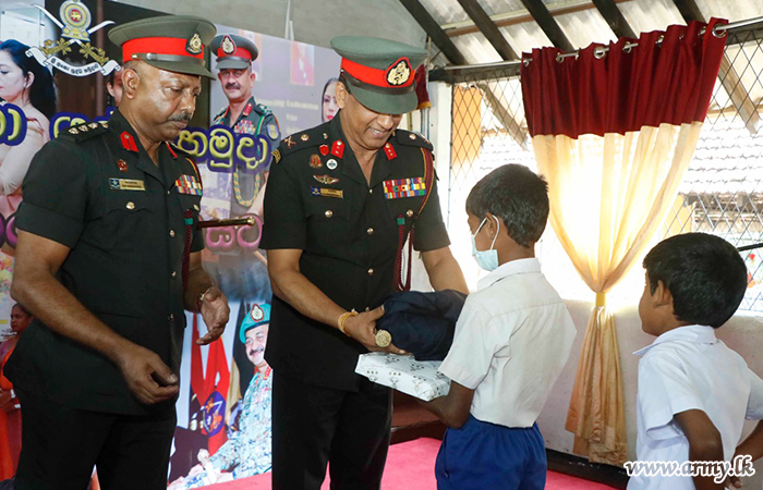 Commander Patronizes Award of Gifts to School Students 