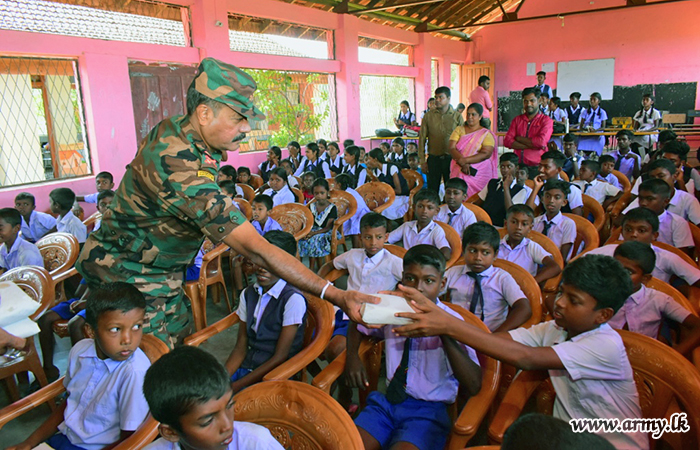 East Commander with Family Members Provides Lunch Packets to 200 Students