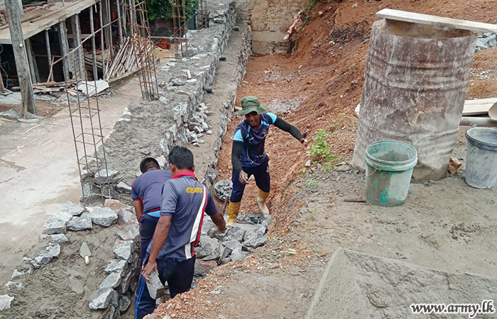 144 Infantry Brigade Troops Assist Reconstruction of Collapsed Temple Wall