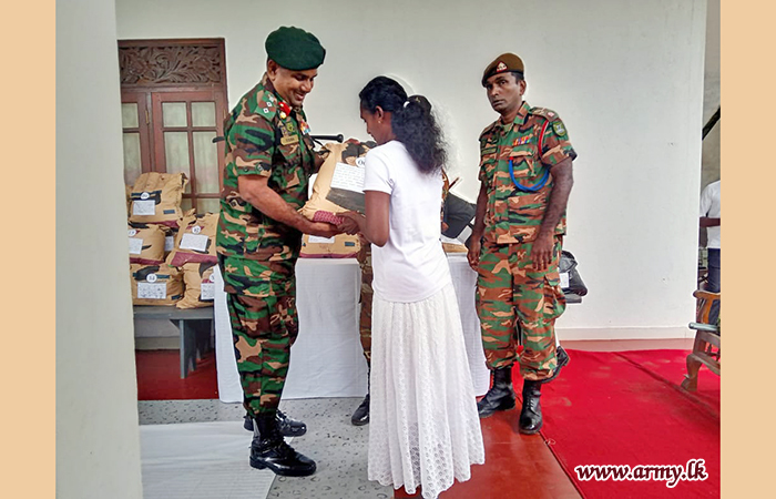 221 Infantry Brigade Troops Mark 'Vesak' Offering Dry Rations to the Poor