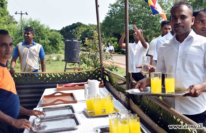 593 Infantry Brigade Troops Serve Cool Drinks on ‘Poson’ Day