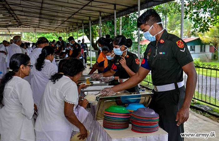 SLCMP Troops Offer Alms to Devotees on Esala Poya Day