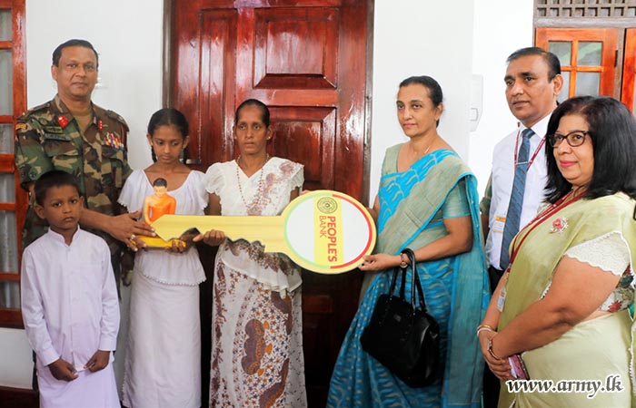 Widow with Three Children, Recipient of Army-Built One More New House