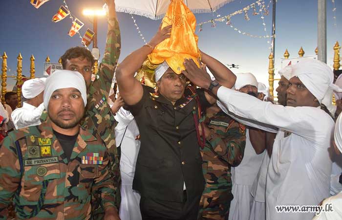Central Troops Assist Procession Carrying ‘God Saman’ Statue