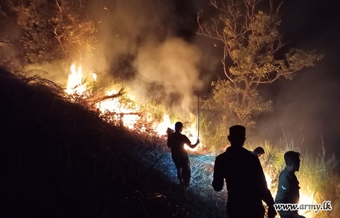 Troops of 611 Infantry Brigade Douse a Fire in Waulpane Aloe Forest Reserve