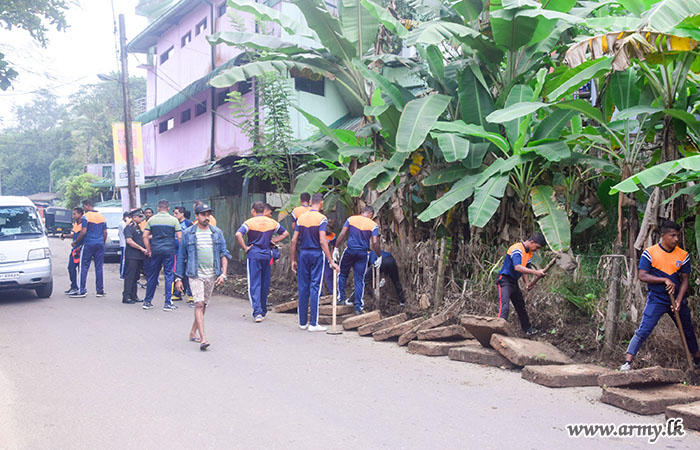 Troops of the Gemunu Watch Conduct a Road Cleaning Programme