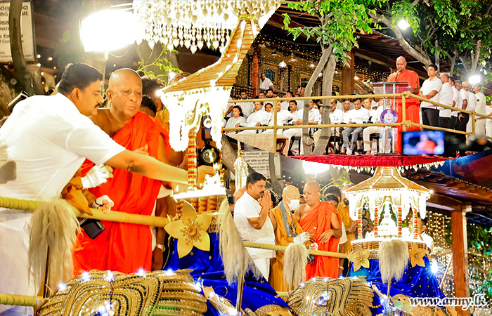 Commander of the Army Presents Floral Offerings to the Sacred Relic Casket during Navam Perahera at Hunupitiya Gangaramaya Temple