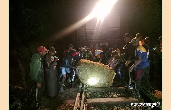 Troops Clear Railway Line Blocked by Landslide