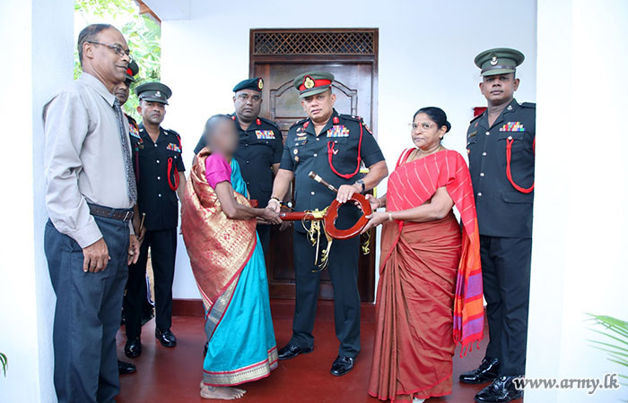 Troops of 9 SLLI Construct New House for Needy Family