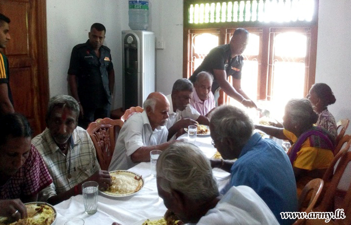 51 Division Troops Offer Lunch Treat to Elders & Villagers
