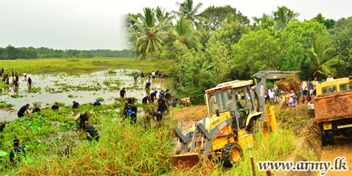 Troops Give Lead to Hingurakgoda 'Chandana Pokuna' Tank Clearing & Renovation 