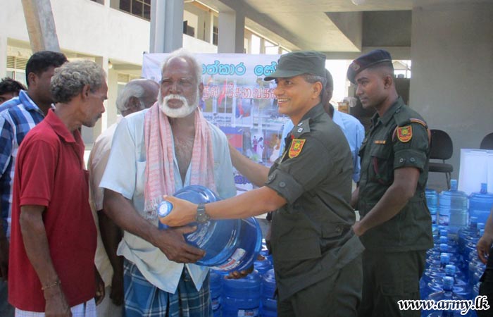 66 Div Troops Distribute Drinking Water Bottles