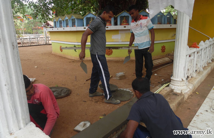 Army Troops Repair Temple Wall on Request