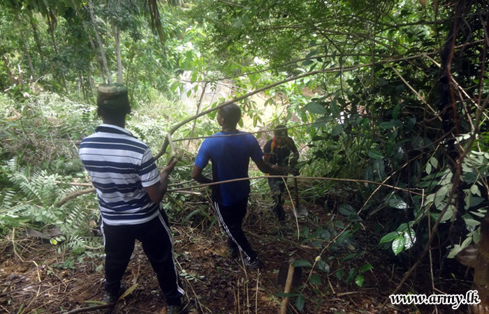 Troops Help Clean Sri Dharmodaya Purana Vihara Premises