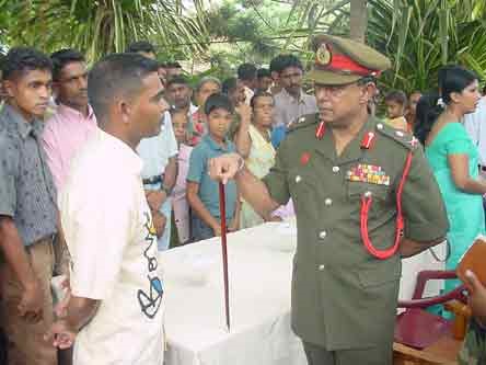  COMMANDER LISTENS TO HARDSHIPS OF AFFECTED FAMILIES OF ARMED FORCES